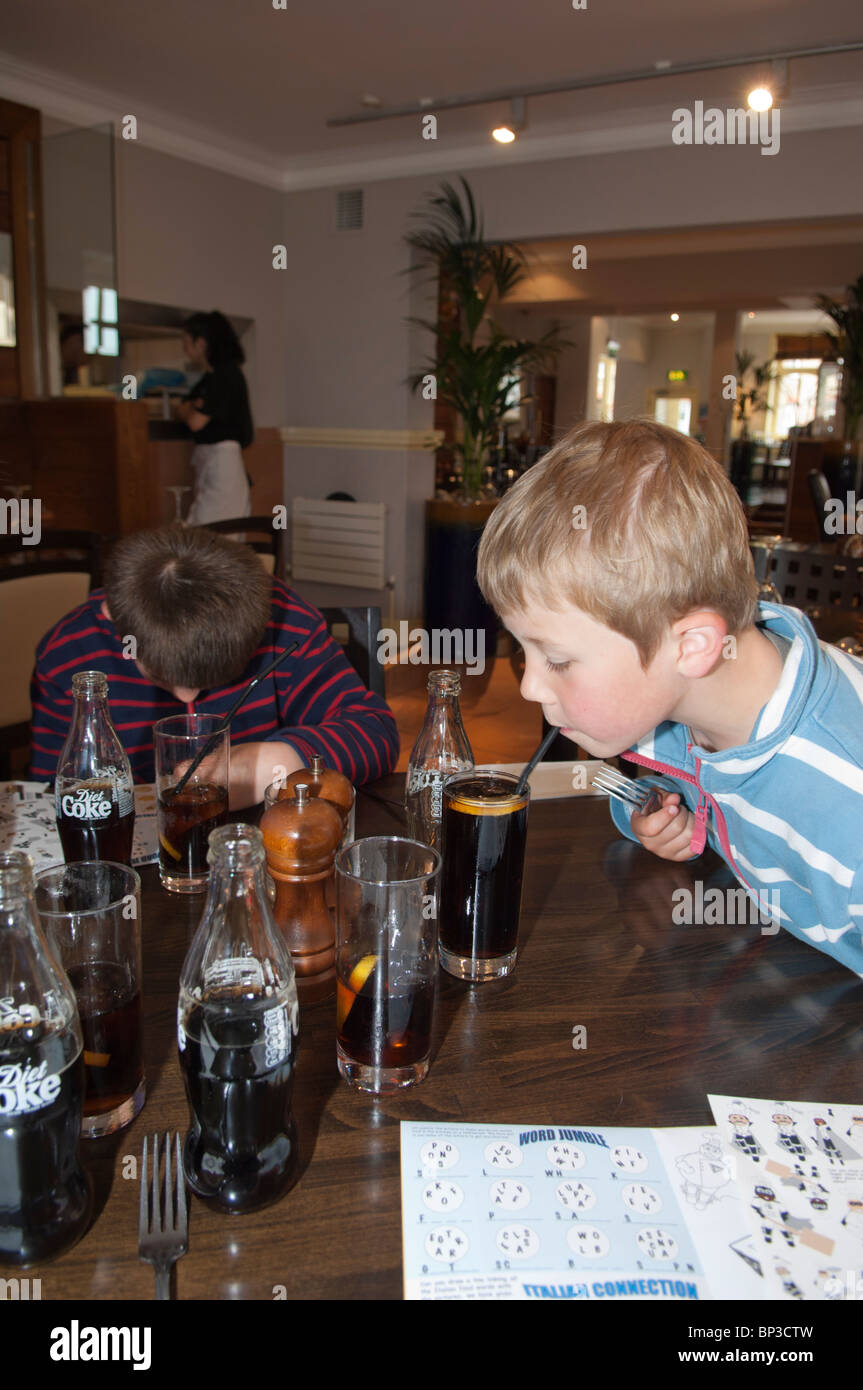 Two boys in Prezzo's Italian restaurant in Aldeburgh , Suffolk , England , Great Britain , Uk Stock Photo