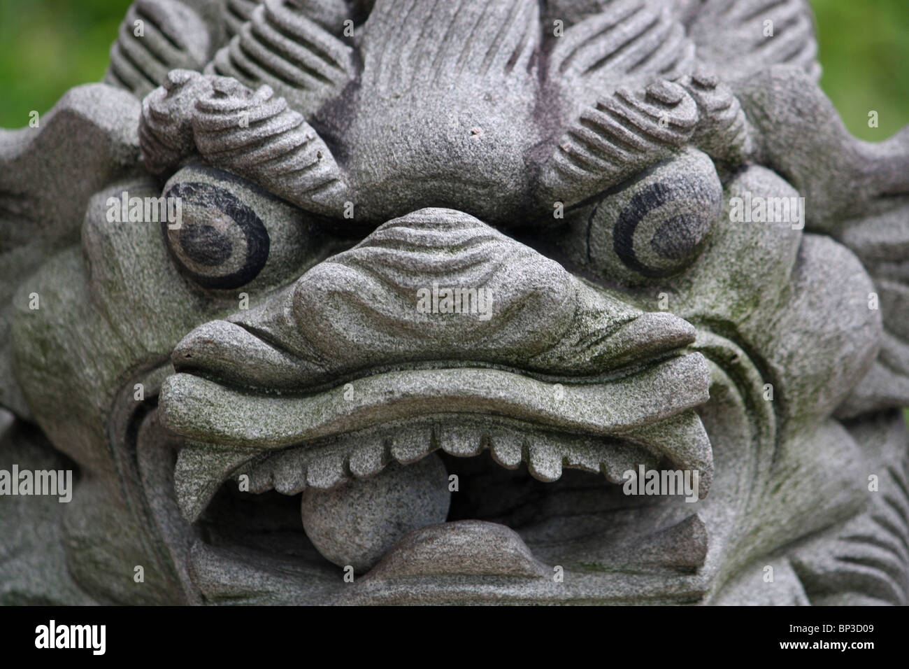 Stone Asian dragon statue with ball in mouth Stock Photo Alamy