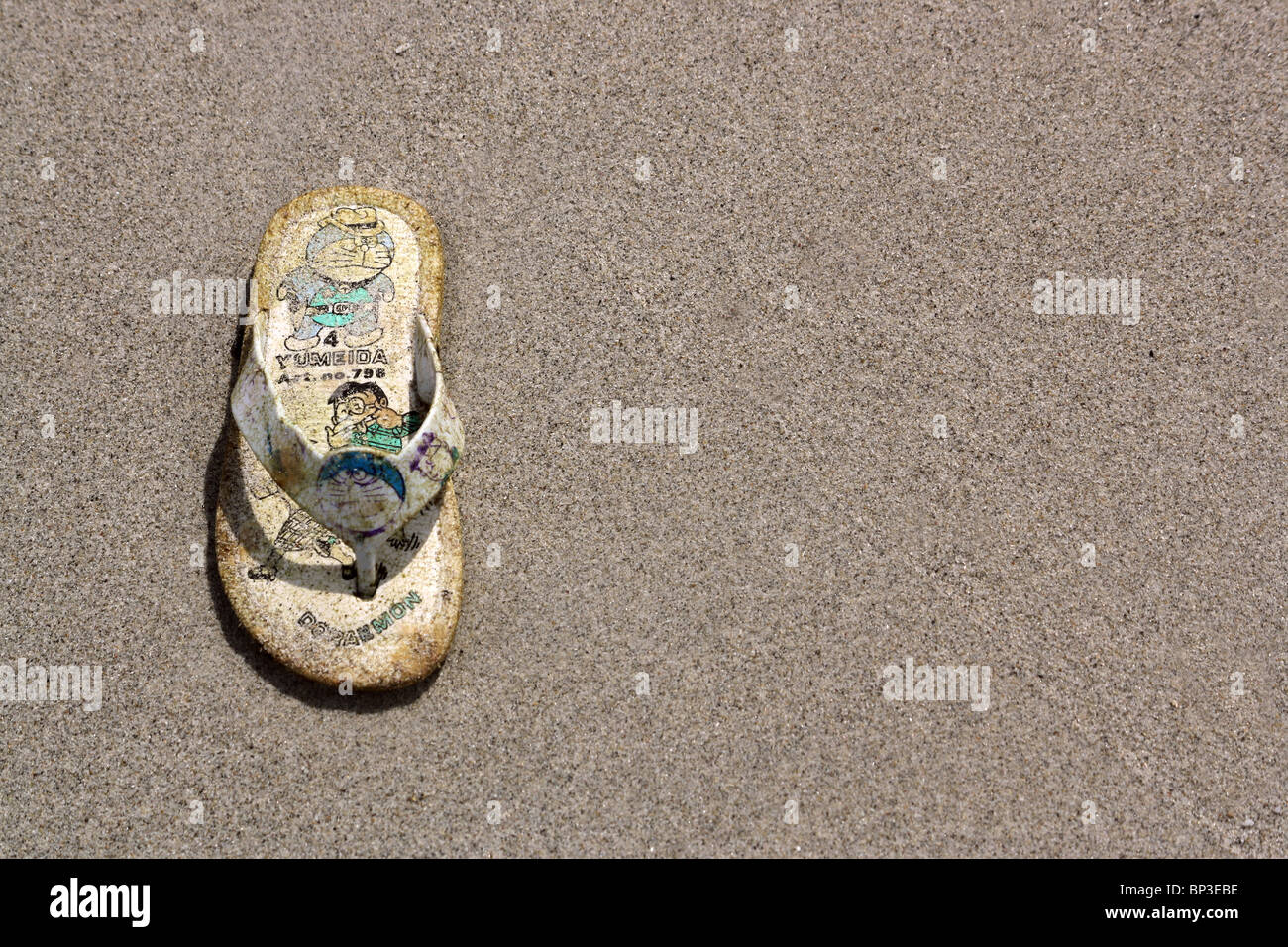 Single shoe on sandy beach Stock Photo Alamy