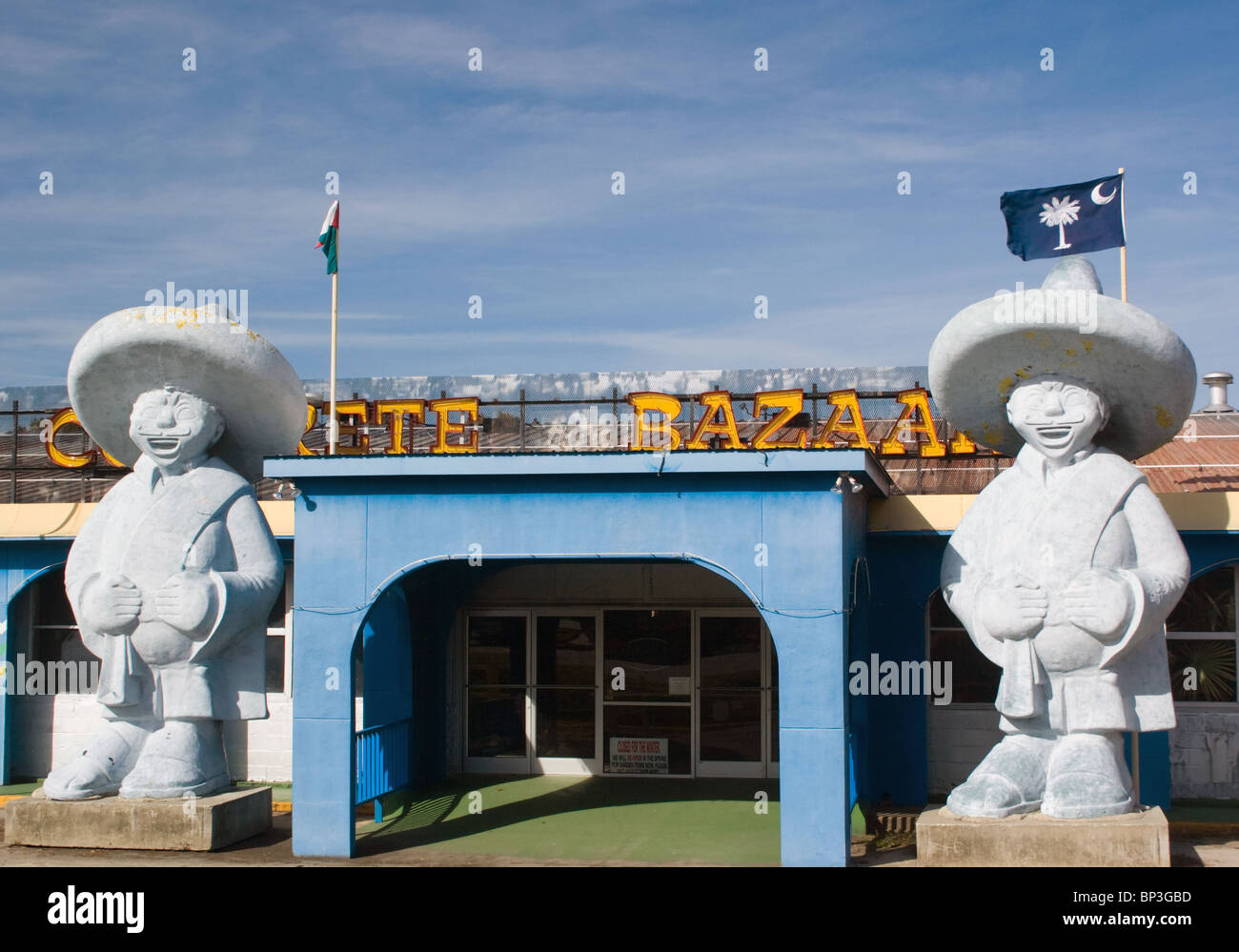 Two concrete Mexican statues in front of a gift shop at South of the Border in Dillon South Carolina Stock Photo