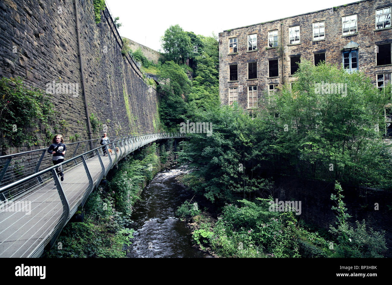 The Millenium Bridge alongside the River Goyt at New Mills, Derbyshire. Stock Photo