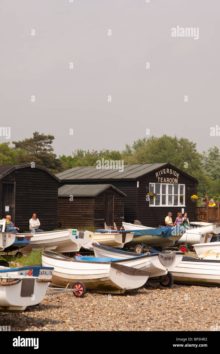 The Riverside tearoom with boats in the foreground at Orford , Suffolk , England , Great Britain , Uk Stock Photo