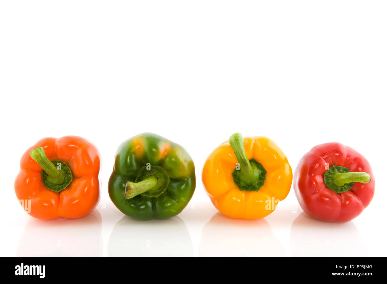 Four different colors of fresh paprika in a row Stock Photo Alamy