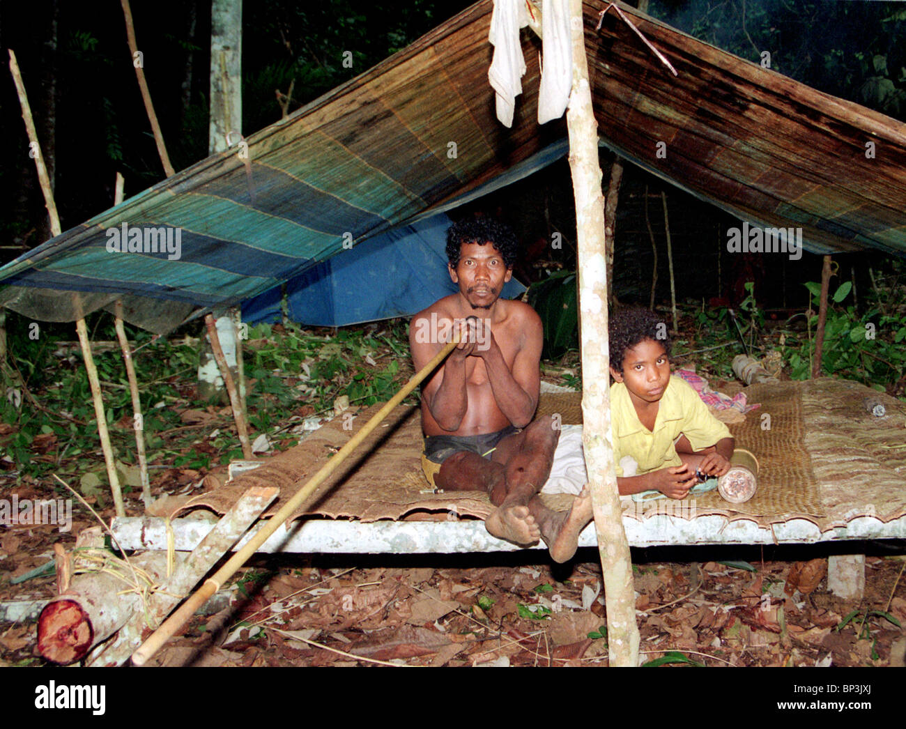 Orang Asli chief demonstrates the blowpipe, Taman Negara, Malaysia Stock Photo
