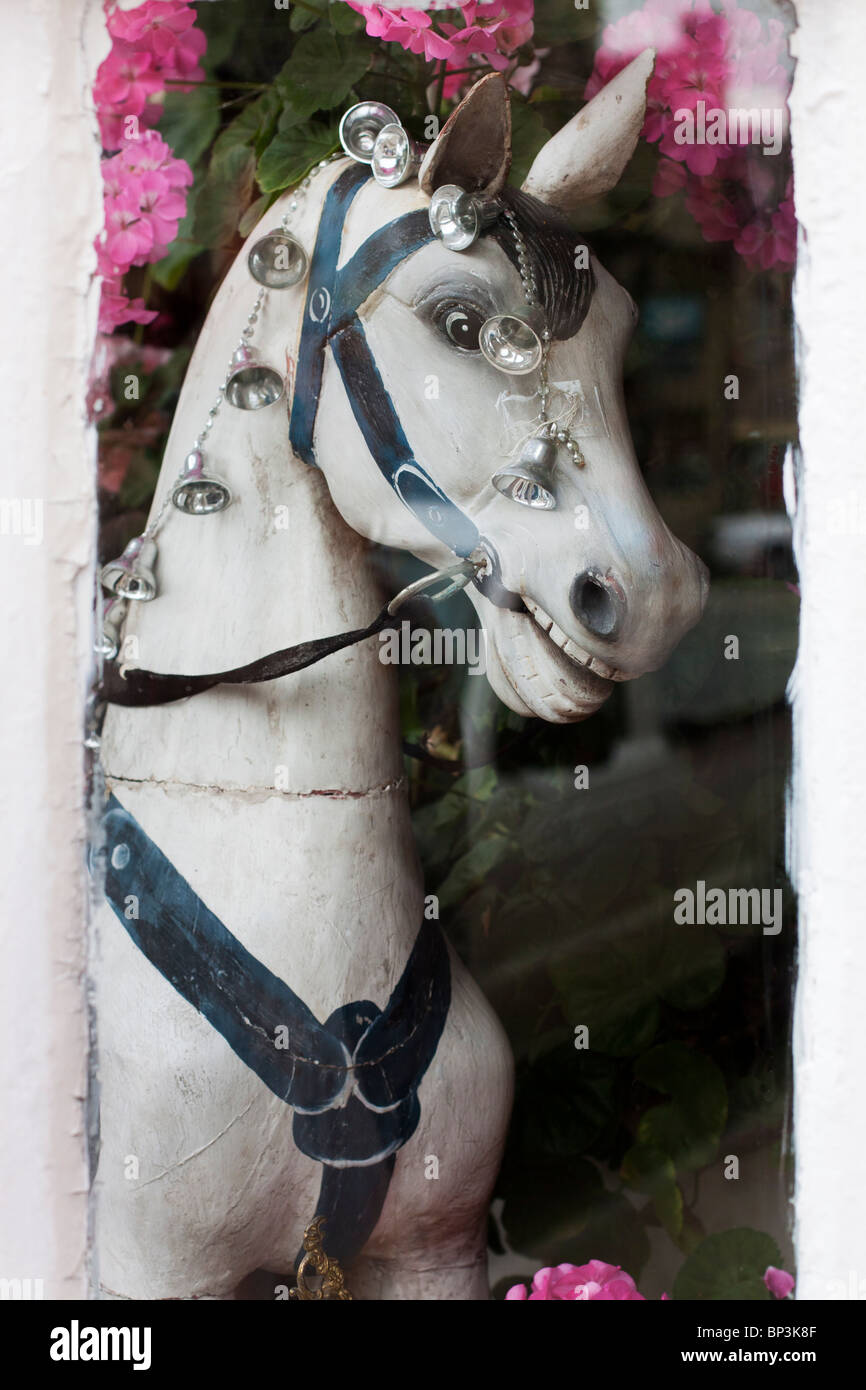 A Old Wooden Hobby Horse Displayed in a shop window Stock Photo