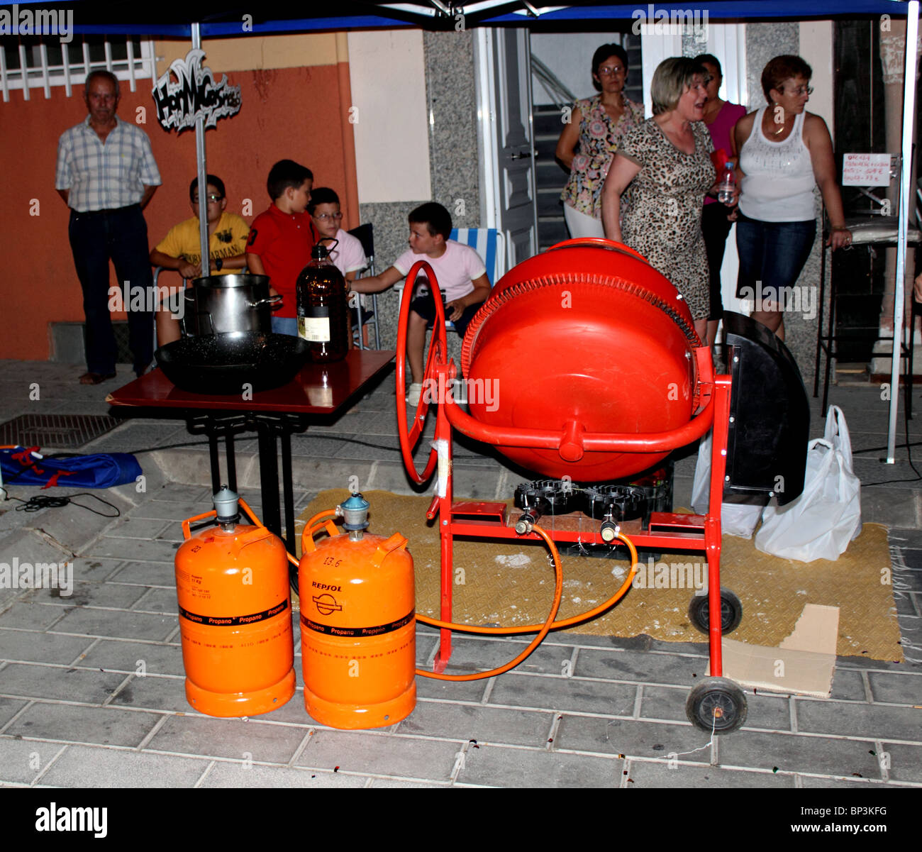 Cement mixer, set up to be used as a giant food mixer to cook at street