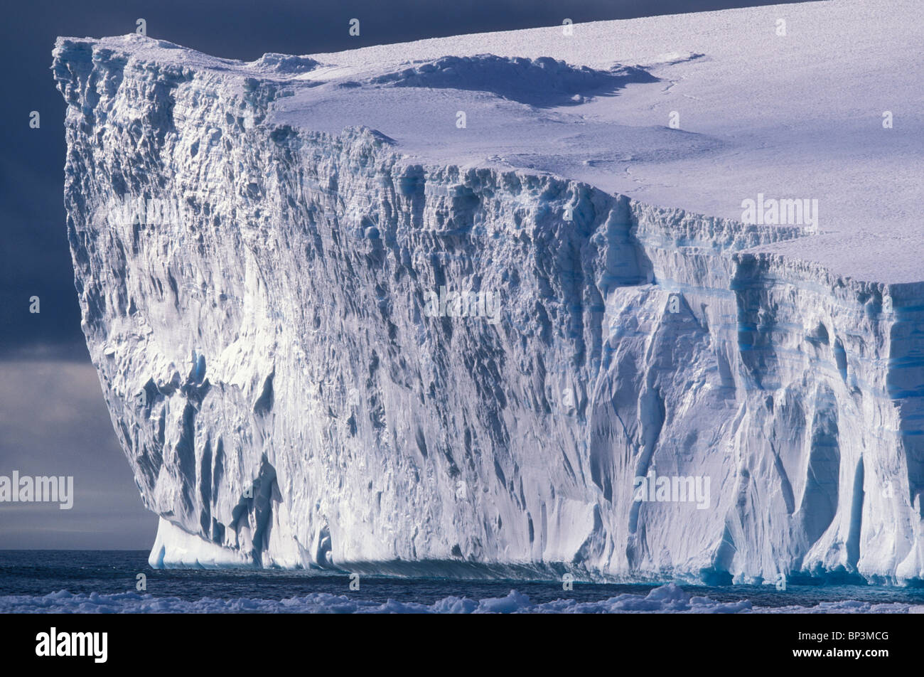 Antarctica, Bransfield Strait, Afternoon sun lights massive tabular iceberg near Livingstone Island Stock Photo