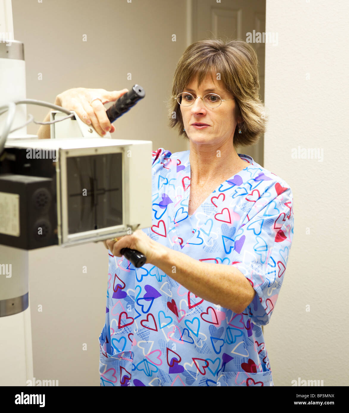 Radiology technician sets up the xray machine Stock Photo Alamy