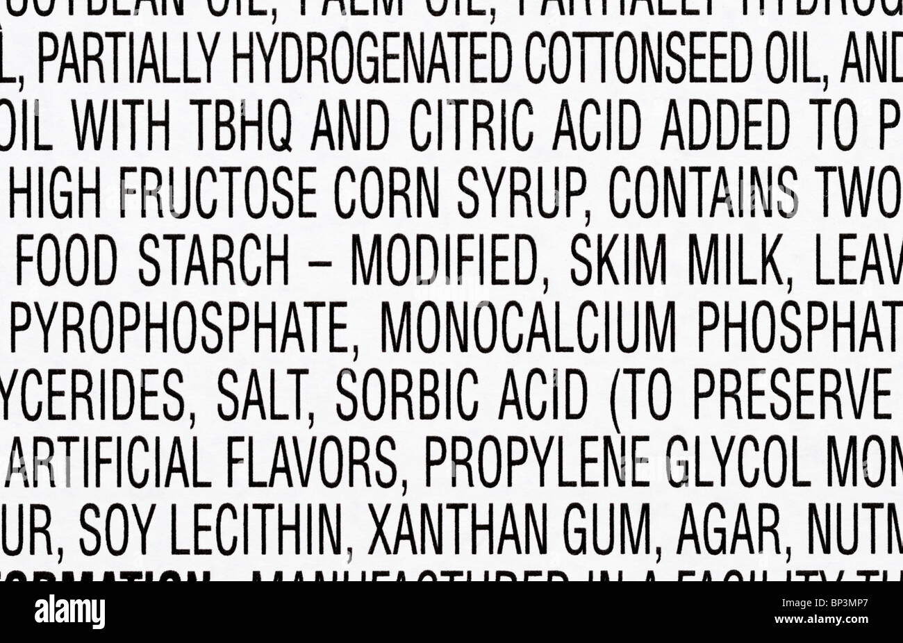 Part of the ingredients list from a package of cupcakes.  Many of the ingredients are artificial and/or unhealthy. Stock Photo