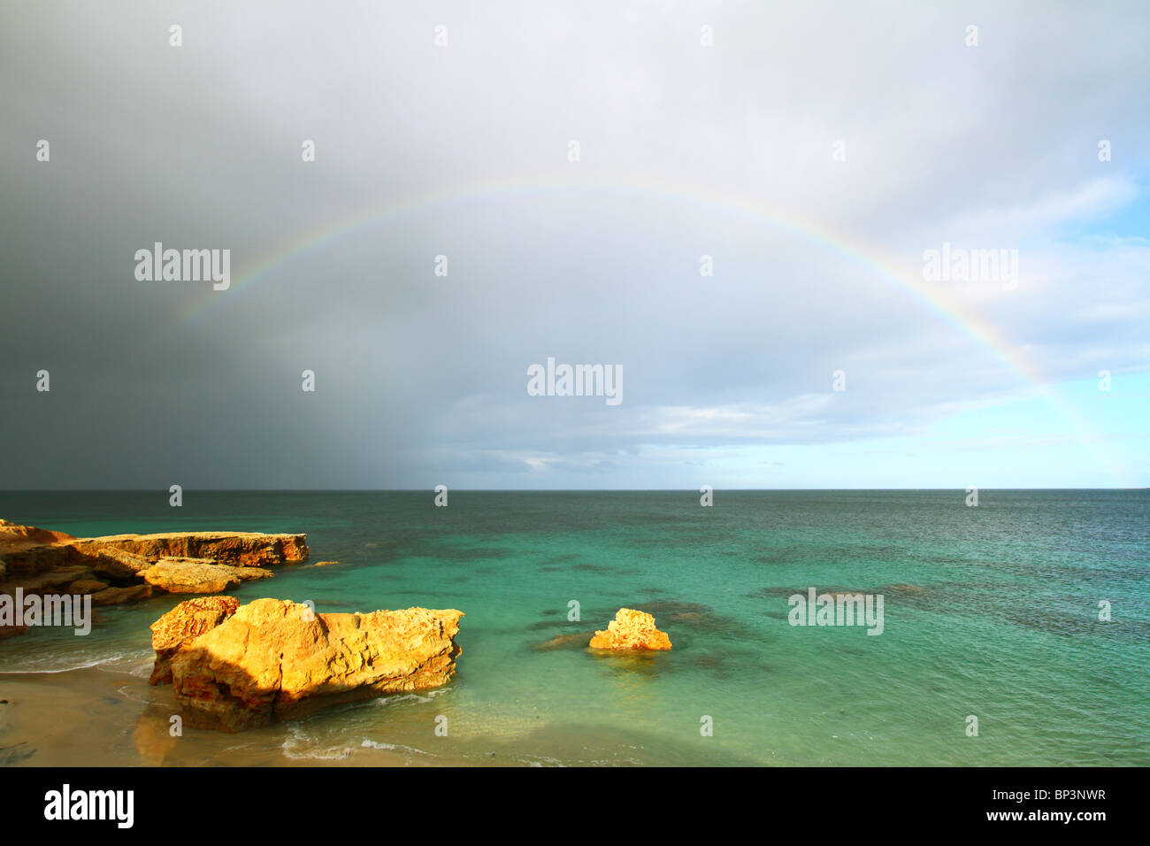 A rainbow over a beach on the Eyre Peninsula, south Australia, Australia. Stock Photo