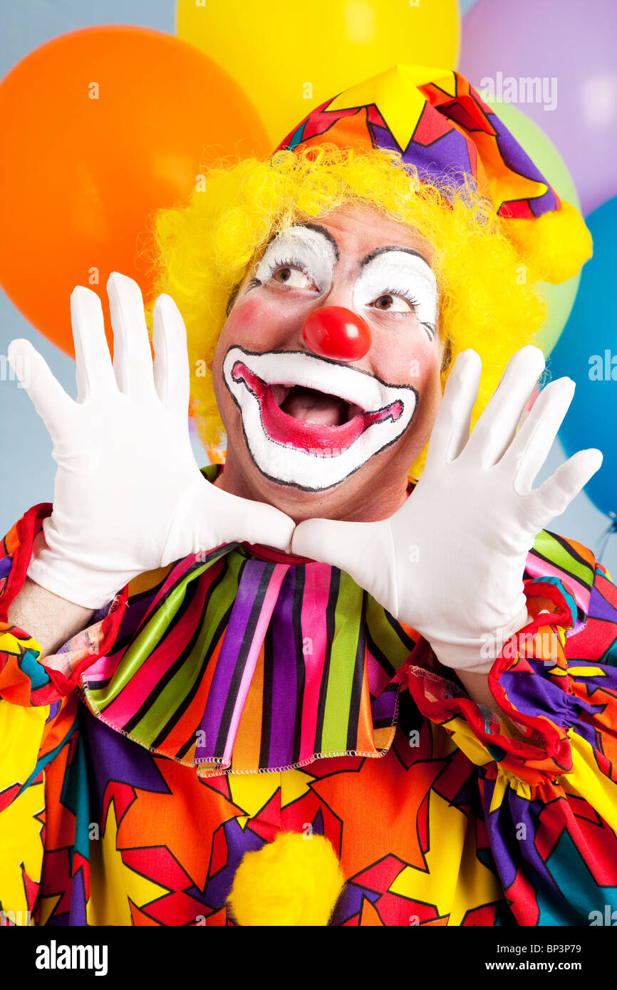 Adorable birthday clown making a jazz hands gesture.  Stock Photo