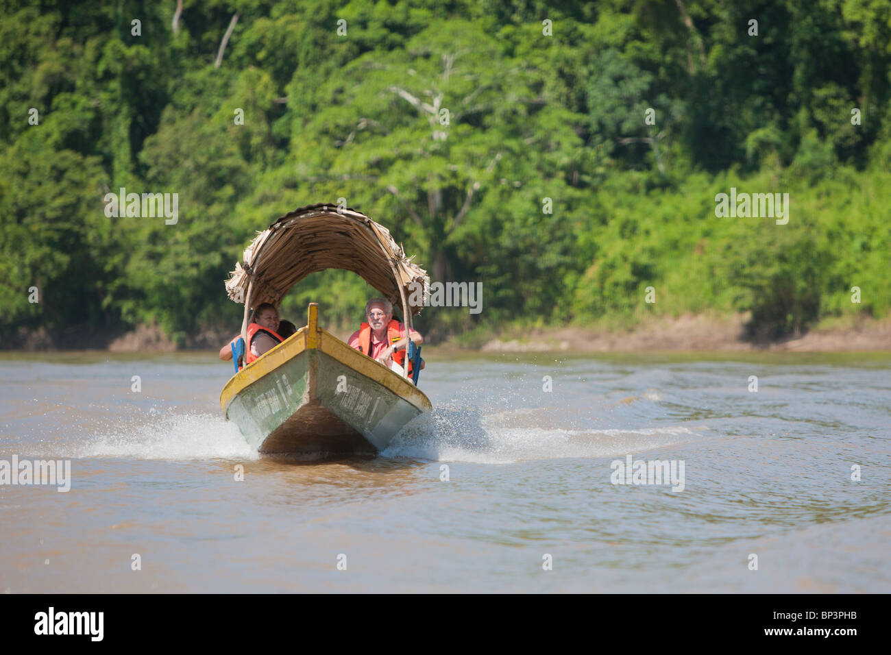 Outboard boat on Usumacinta River taking tourists to Yaxchilan