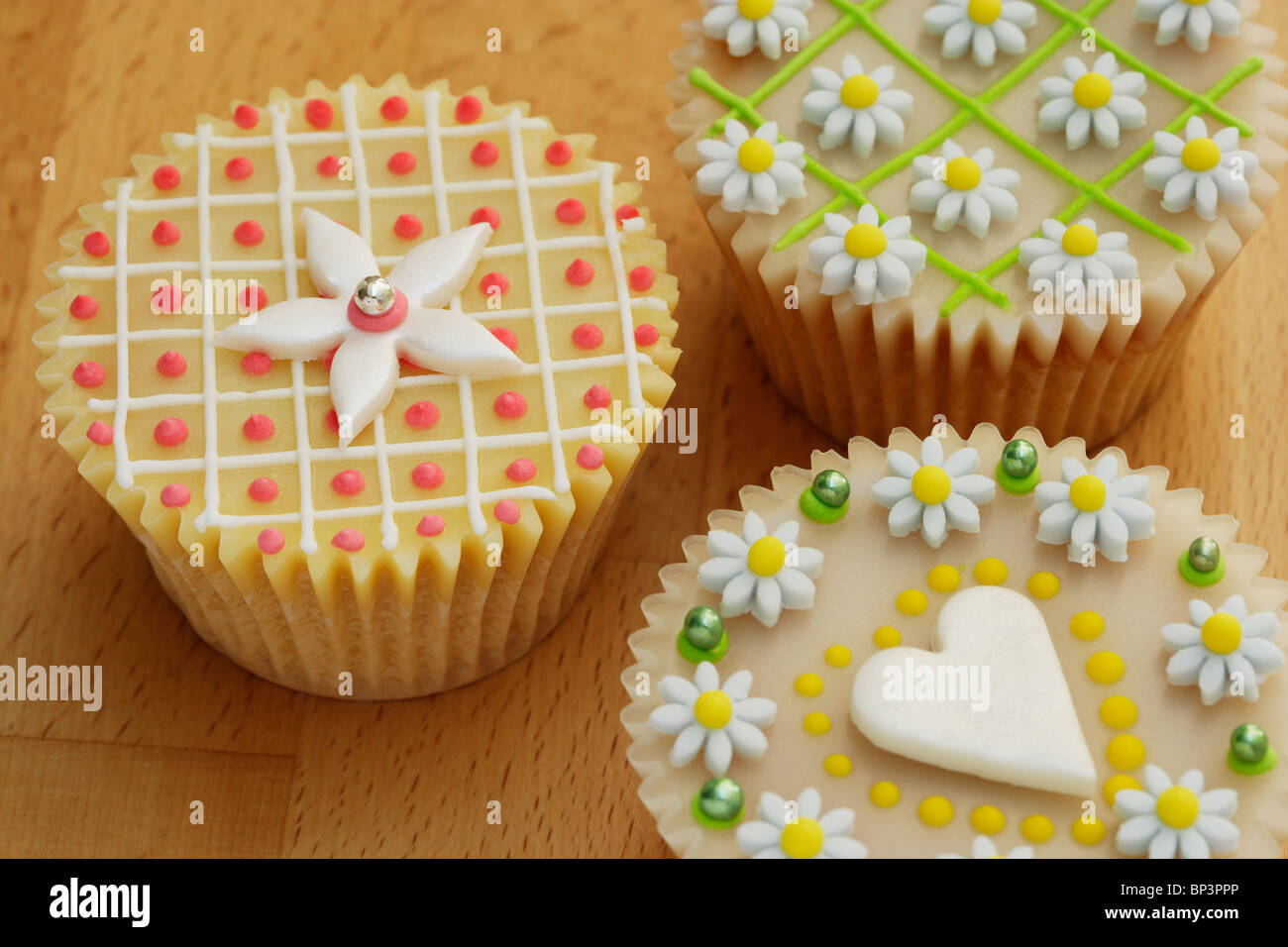 Highly decorated cup cakes Stock Photo Alamy