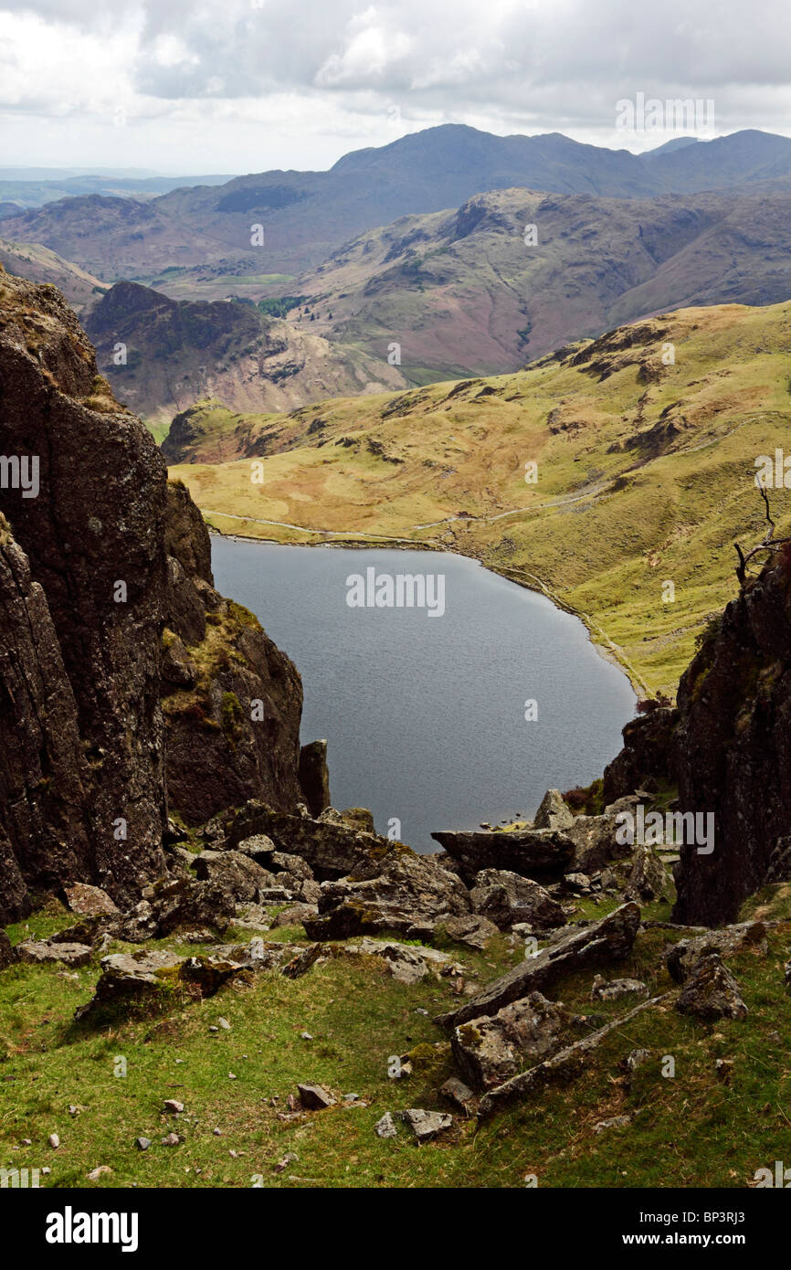 Looking down onto Stickle Tarn from the top of East Gulley on Pavey Ark in the Lake District National Park, Cumbria, England. Stock Photo