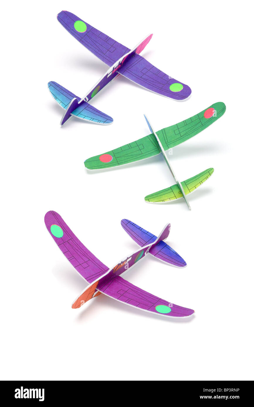 Colorful Styrofoam toy planes arranged on white background Stock Photo