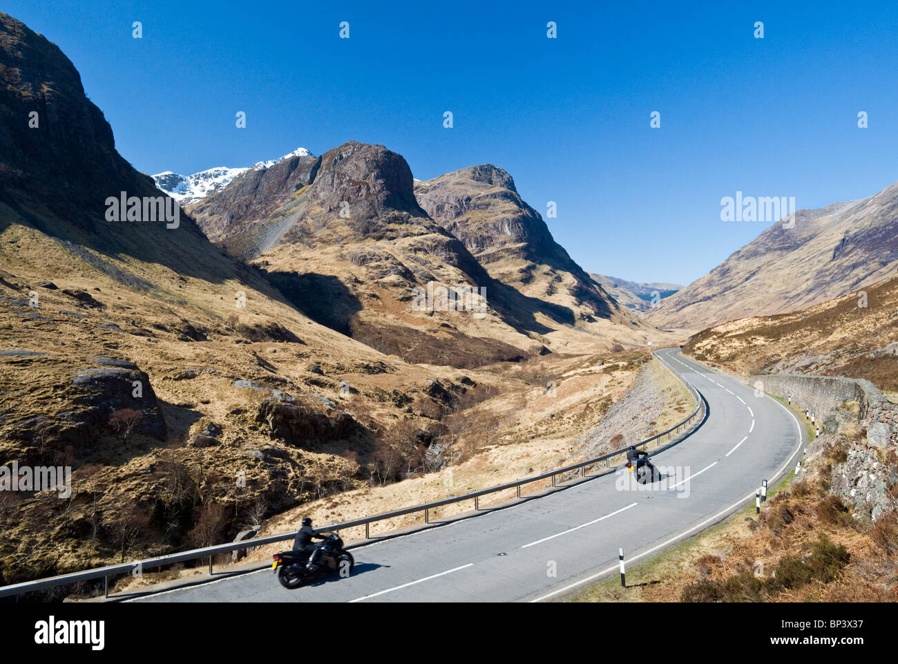 Motorcyclists Passing the Three Sisters Through Glencoe, Scottish Highlands, Scotland, UK Stock Photo