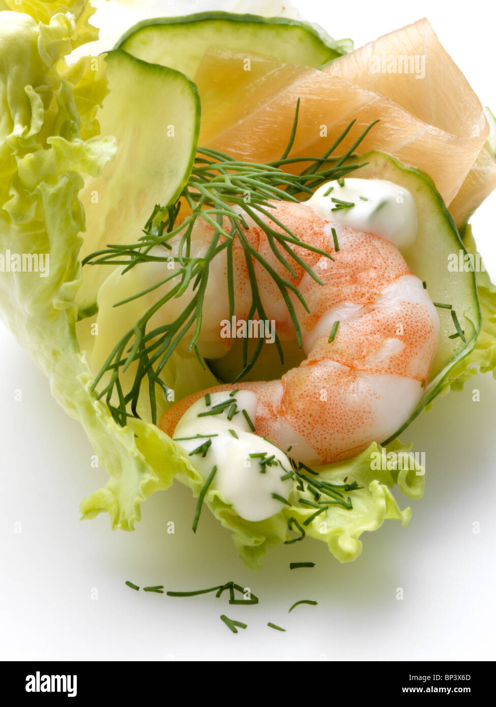 A prawn with smoked salmon lettuce cucumber slices and dill Stock Photo