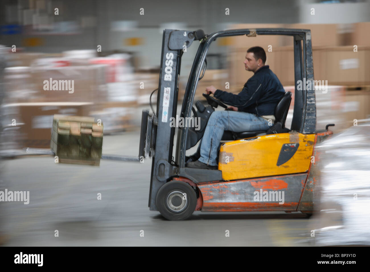 A fork-lift driver of a spedition company Stock Photo