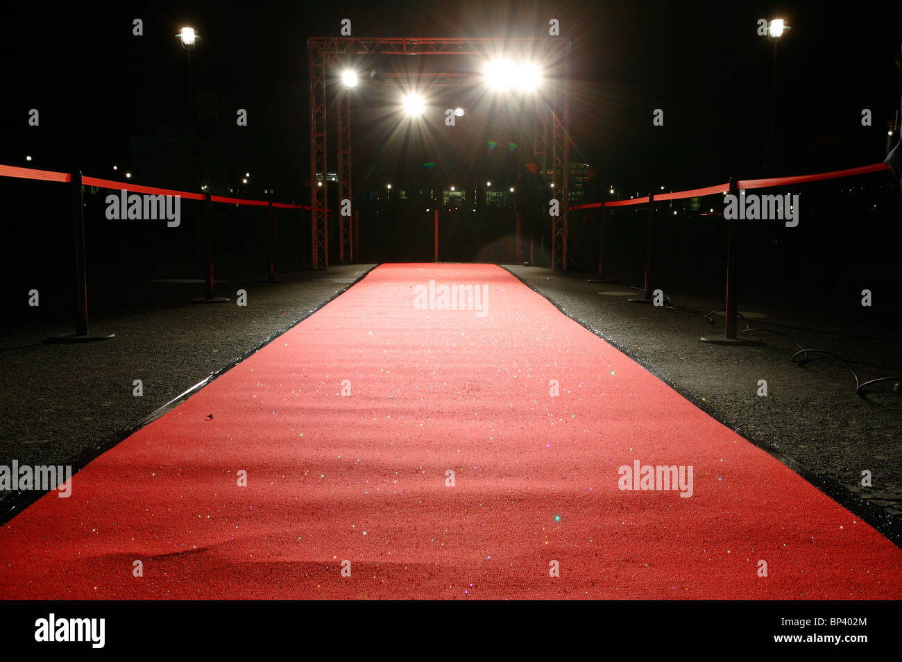 Red carpet in floodlight Stock Photo