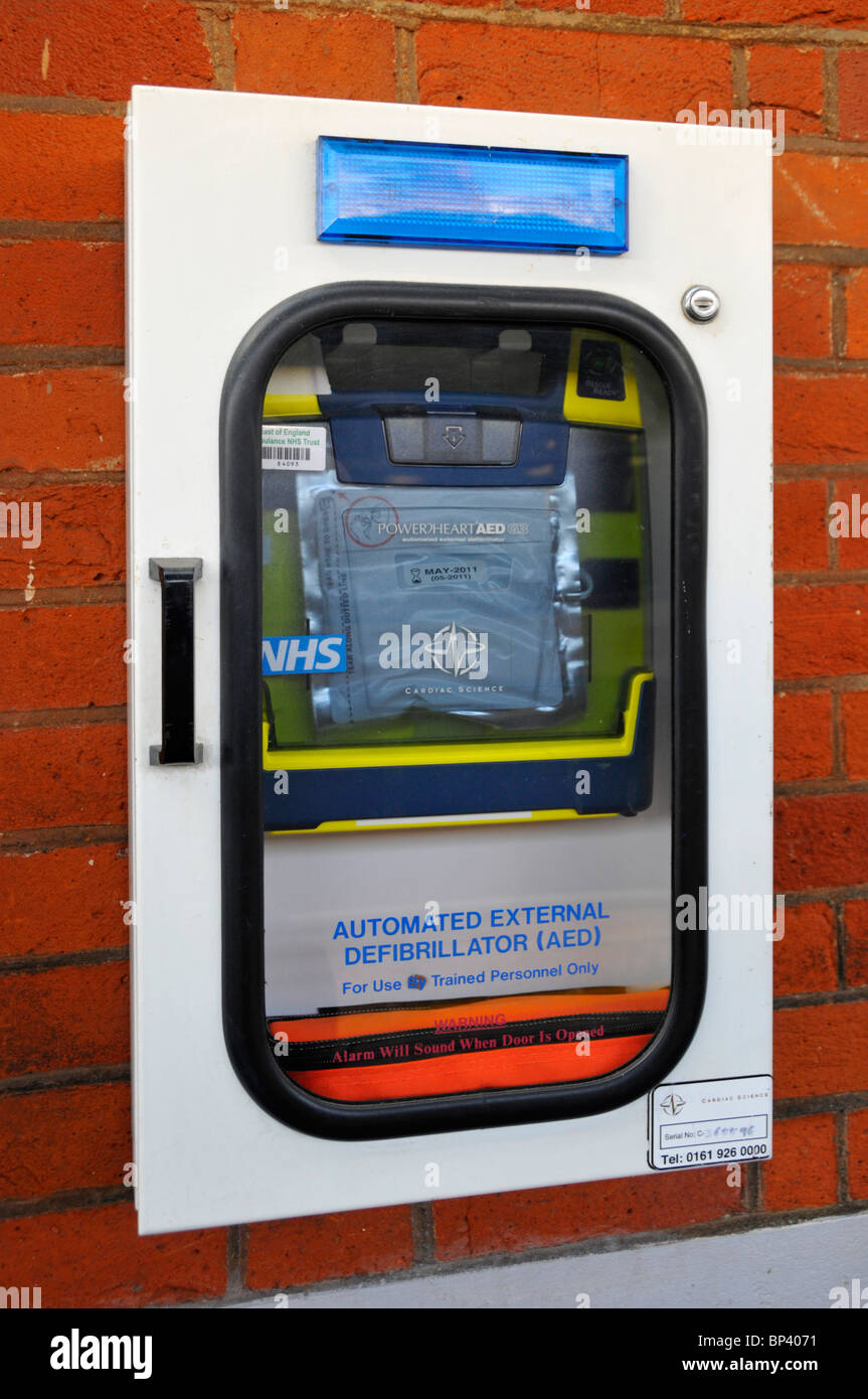 Automated external defibrillator on train station an NHS electronic healthcare device that sends an electric shock to assist heart attack recovery UK Stock Photo