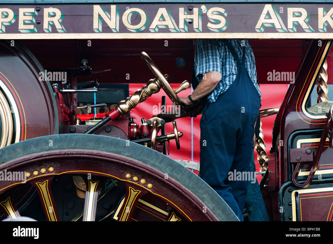 Two Men driving a Showmans Traction Engine at a steam fair in England Stock Photo