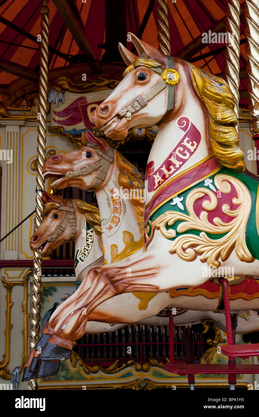 Steam Galloping horse carousel fairground ride at a  steam fair in England Stock Photo