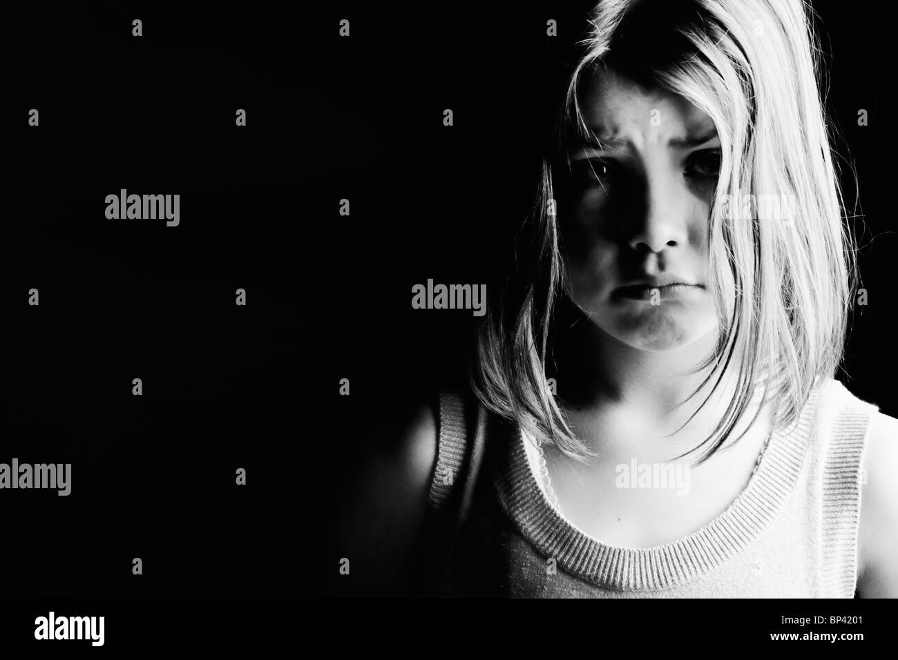 Powerful Black and White Shot of a Sad Looking Child. Images of Neglect Stock Photo