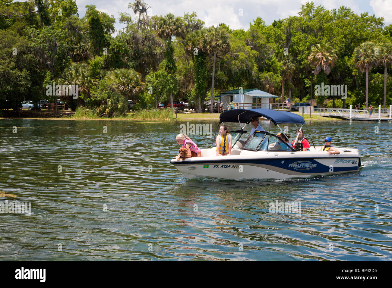 Boy driving boat hi-res stock photography and images - Alamy