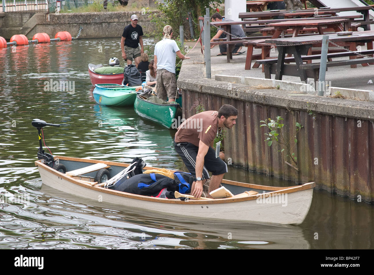 canoing canoeist mooring looking visit pub river Stock Photo
