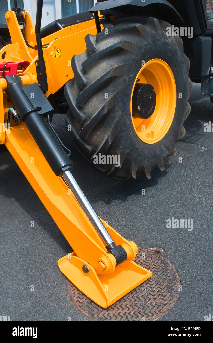 Hydraulic support arm of JCB Telescopic Handler on road grid cover - France. Stock Photo
