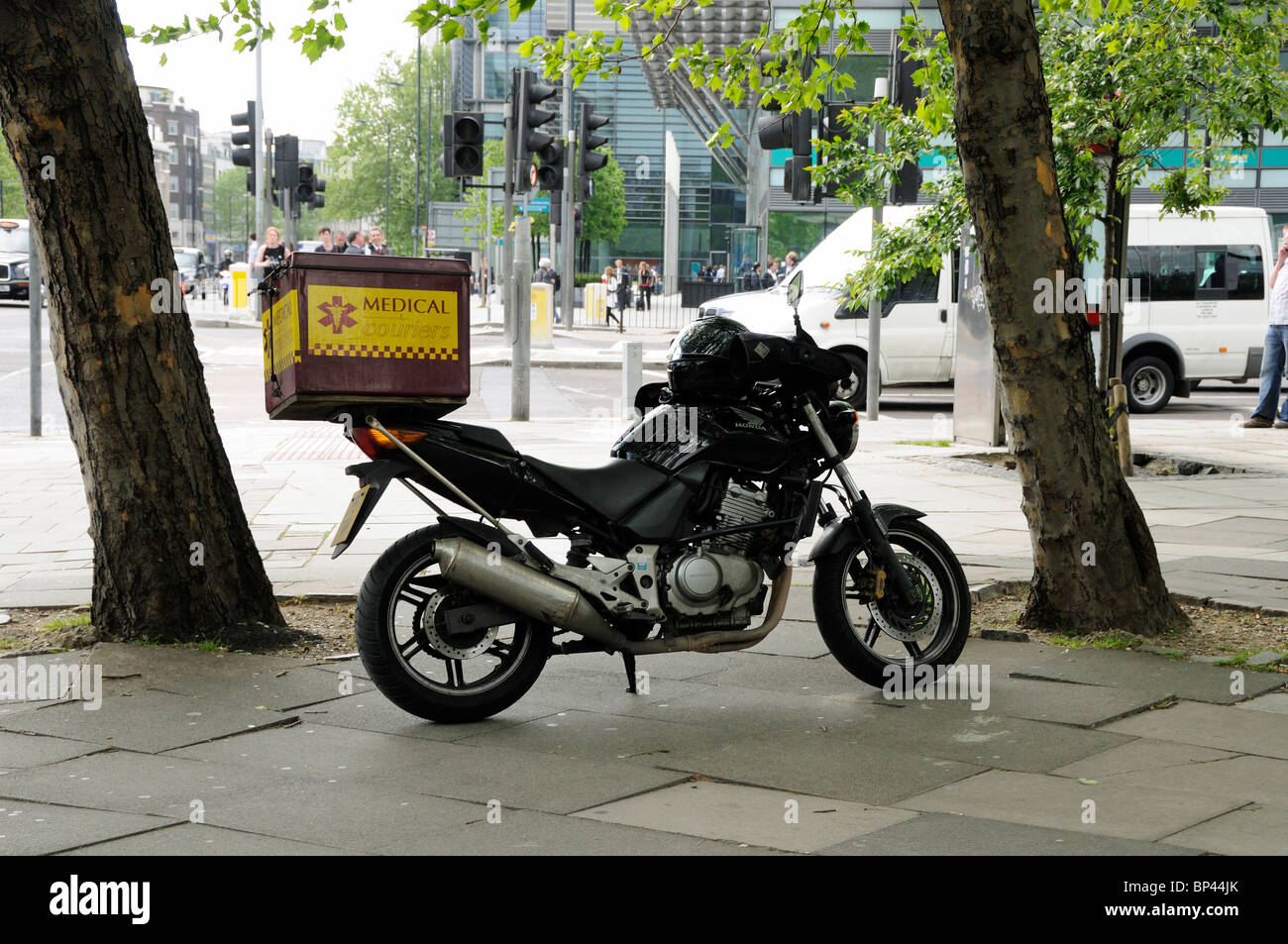 Medical Couriers Motorbike parked on pavement Euston Road London England Britain UK Stock Photo