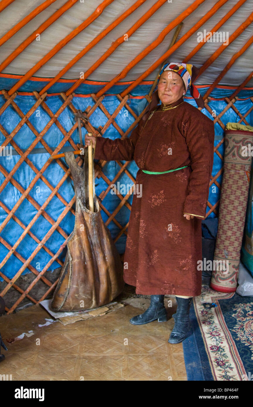 Zandankhuu, nomad woman churning camel milk Stock Photo