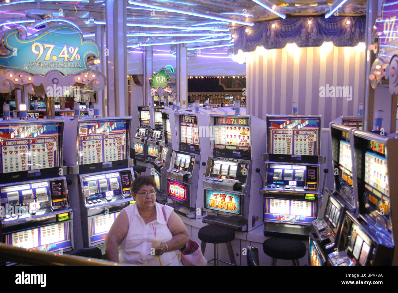 Player by a gambling machine, Las Vegas, USA Stock Photo Alamy