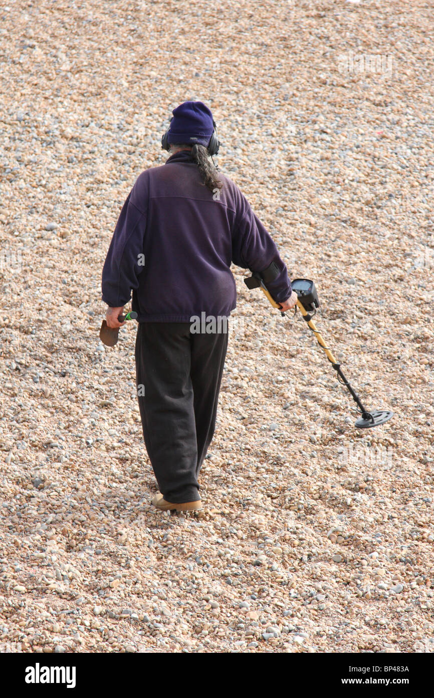 A man with a metal detector on Brighton beach Stock Photo Alamy