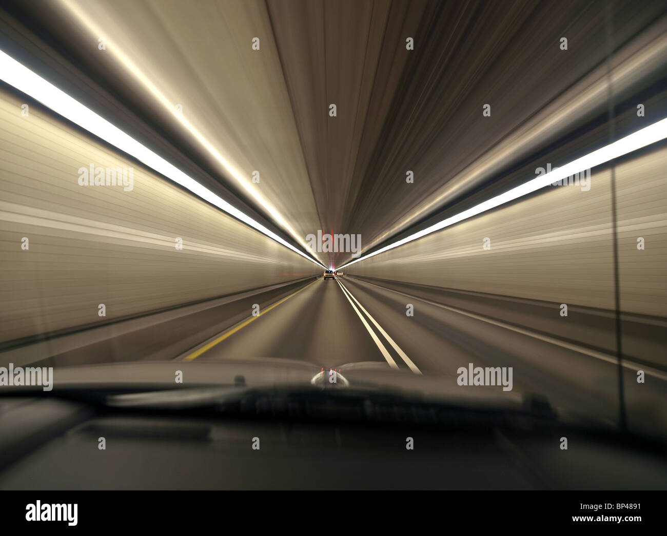 Speeding through a deep urban tunnel in Pittsburgh Pennsylvania. Stock Photo