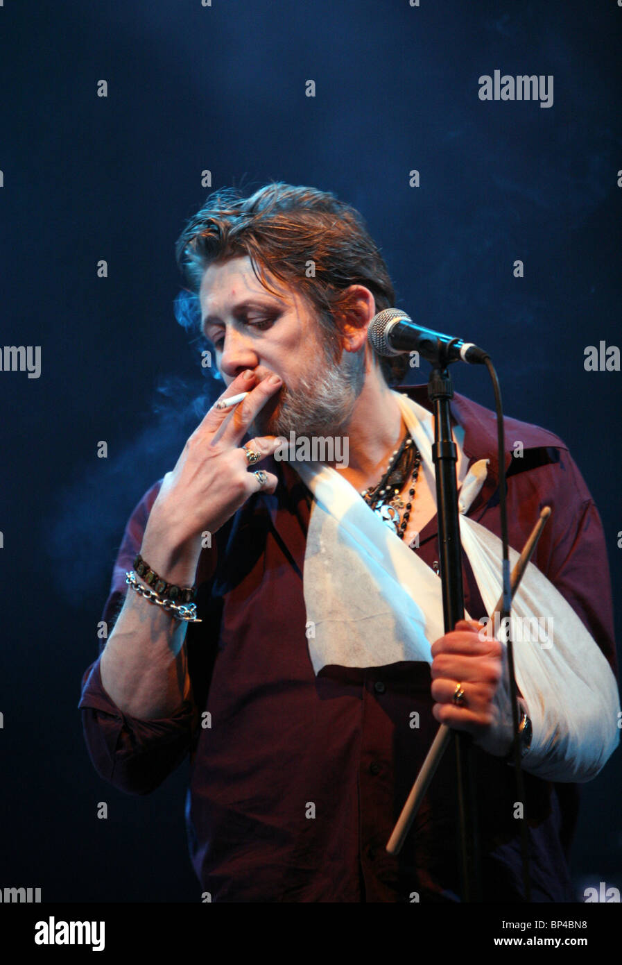 Shane MacGowan of The Pogues performing live on stage at V