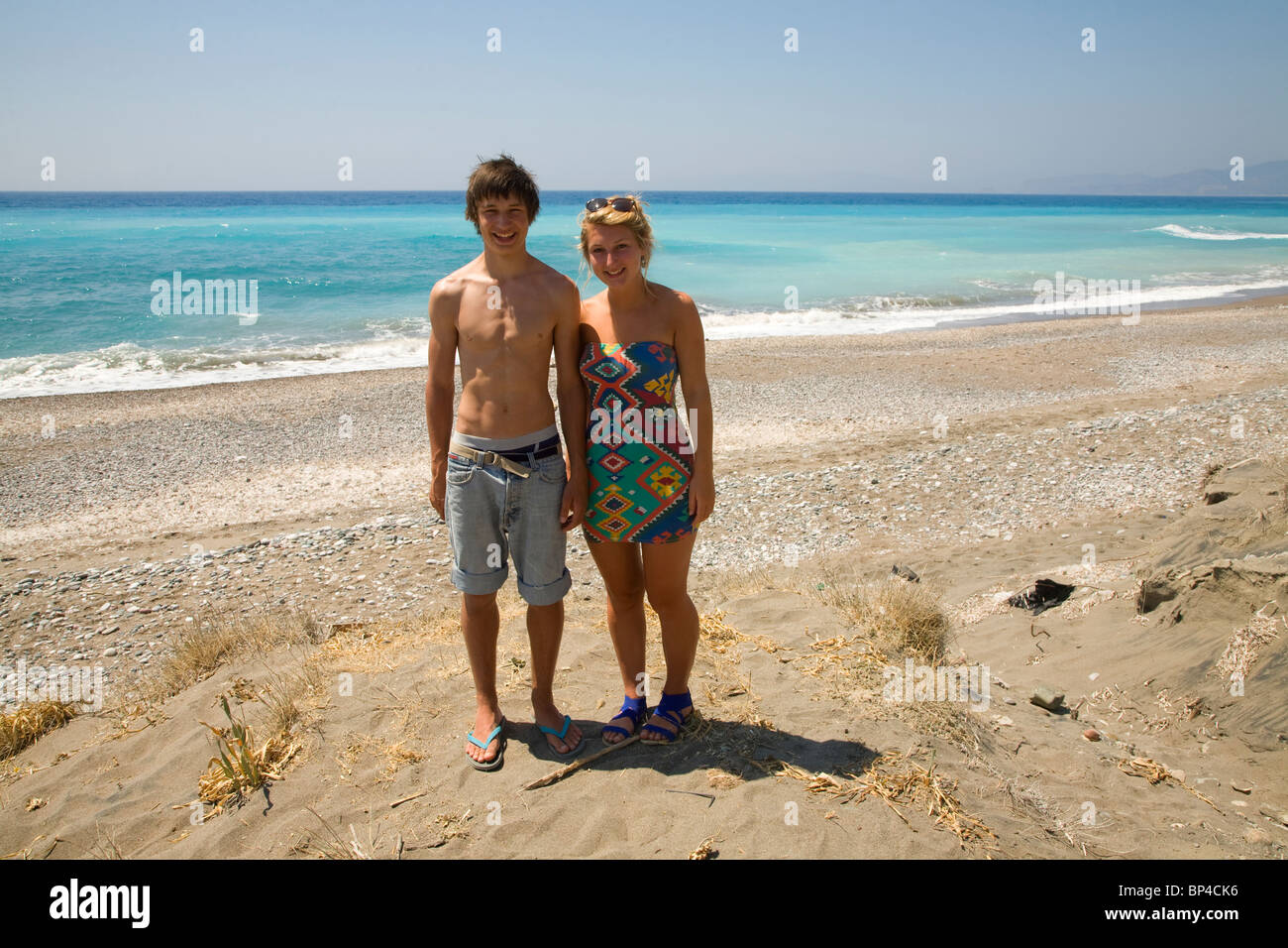 Teenage Boy And Girl Twins Stand By Sea On Sandy Beach Stock Photo Alamy