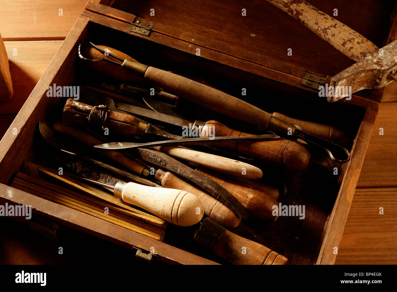 srtist hand tools for handcraft works on golden wood background Stock Photo