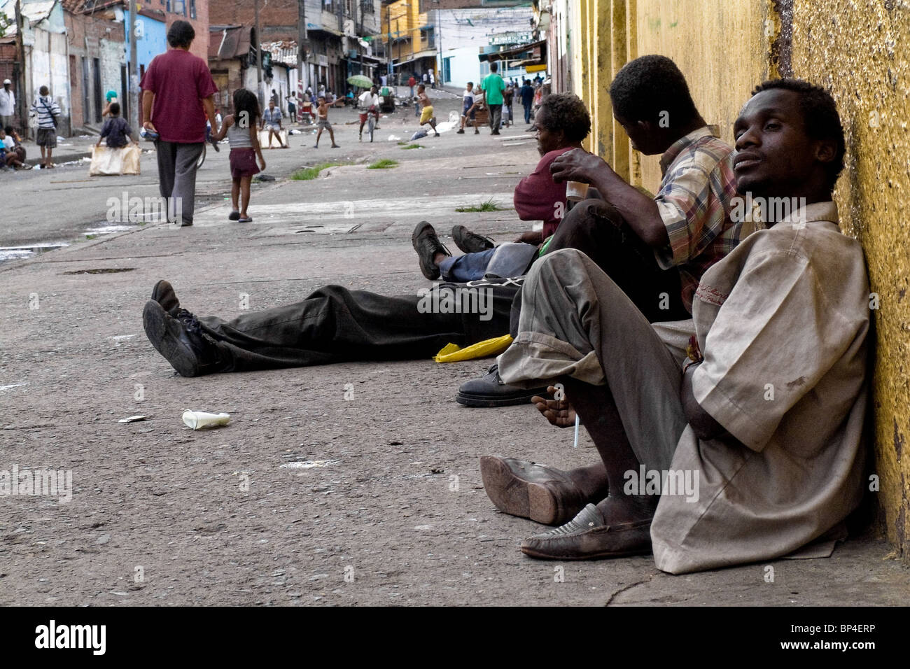 Colombian drug addicts lying on the street in the slum of Calvario, Cali, Colombia. Stock Photo