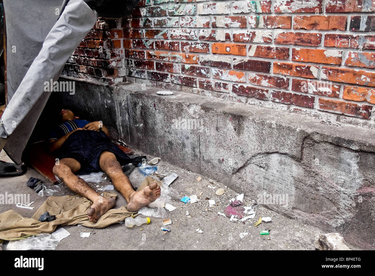 a-dirty-colombian-drug-addict-lying-on-the-street-in-the-slum-of-calvario-BP4ETG.jpg