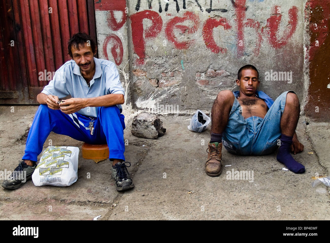 A drunk Colombian garbage recollector sleeping on the street in the