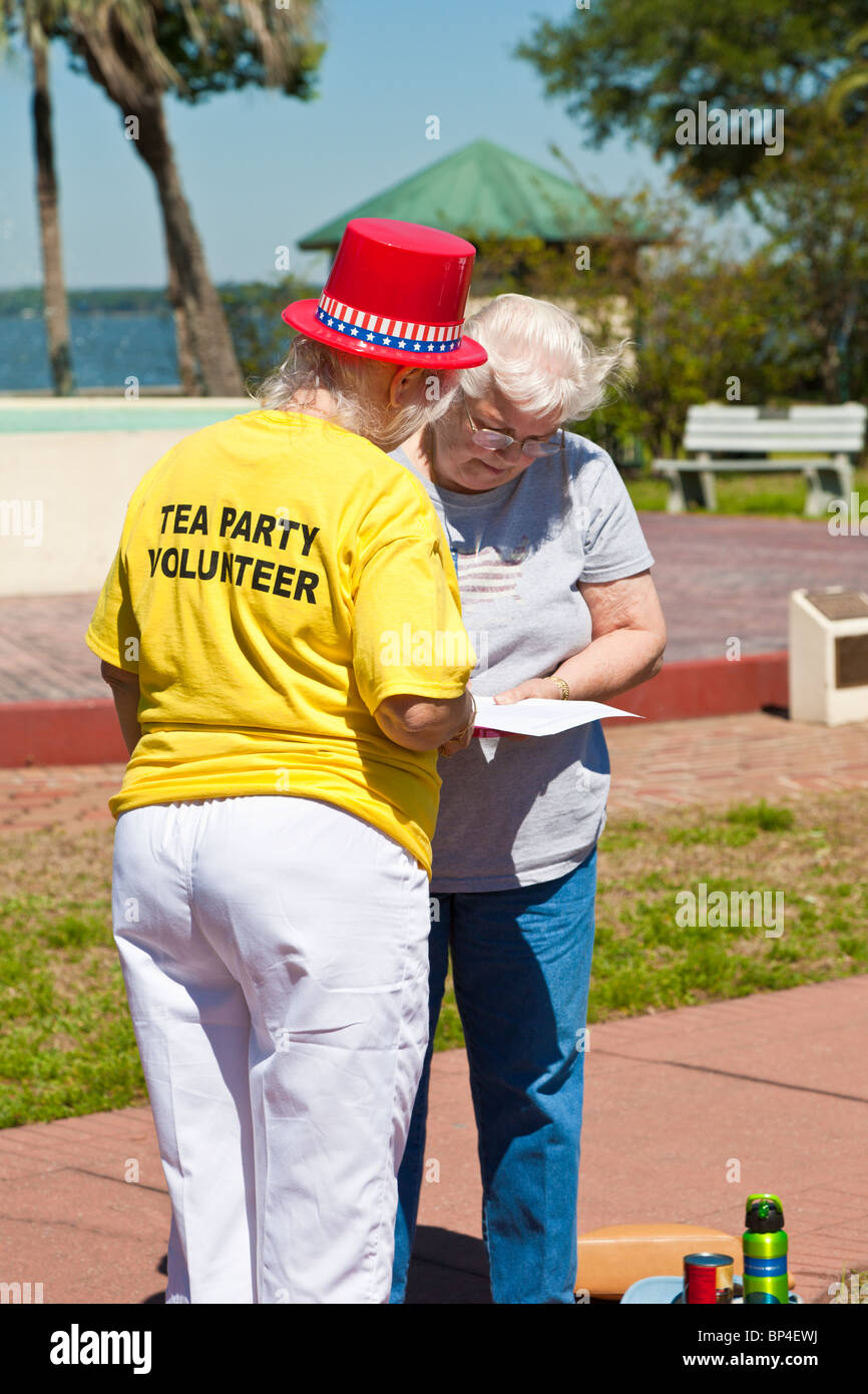Concerned citizens signing Fair Tax petitions at a Tea Party political event at Farran Park in Eustis, Florida Stock Photo