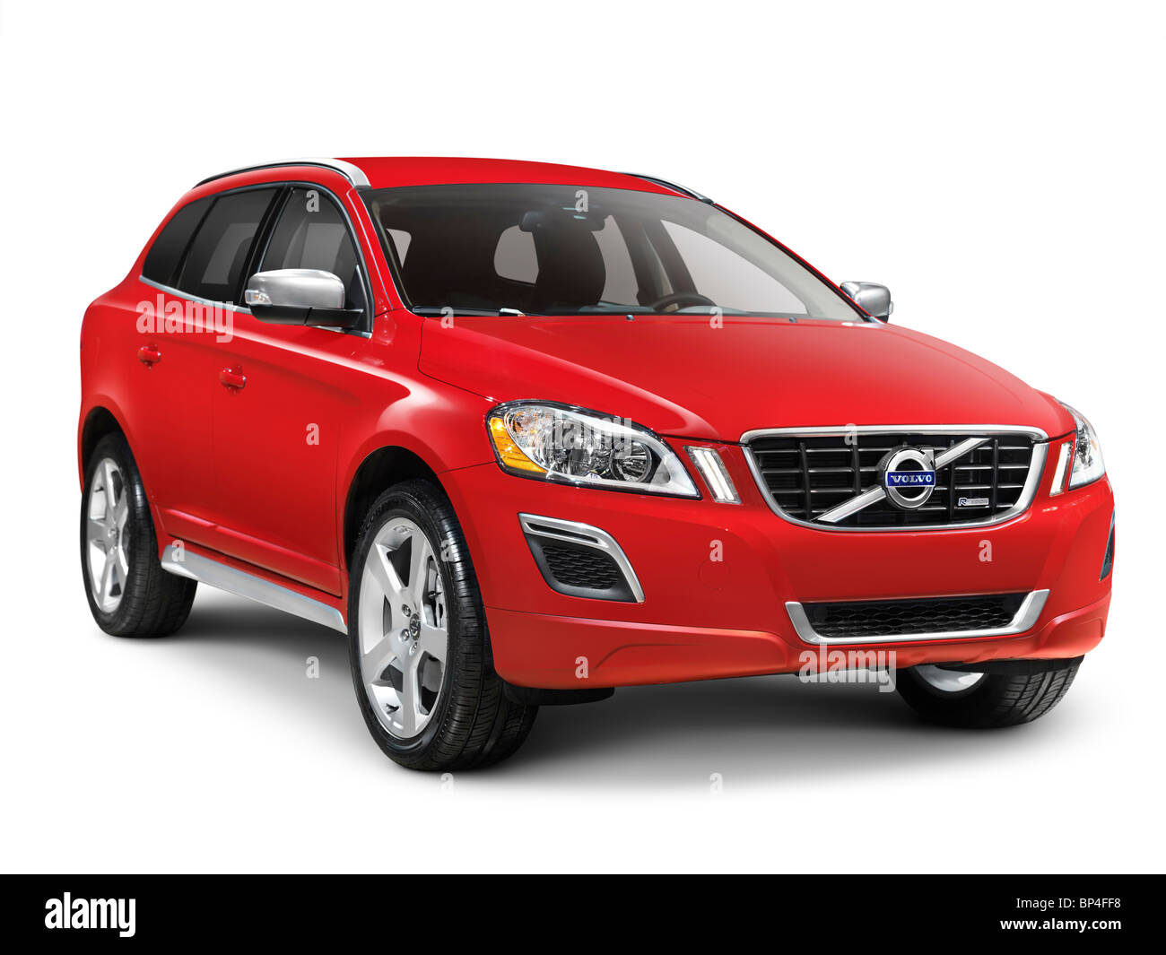 License available at MaximImages.com - Red 2010 Volvo XC60 T6 AWD R-Design midsize SUV the safest car to date. Isolated on white background with clipp Stock Photo