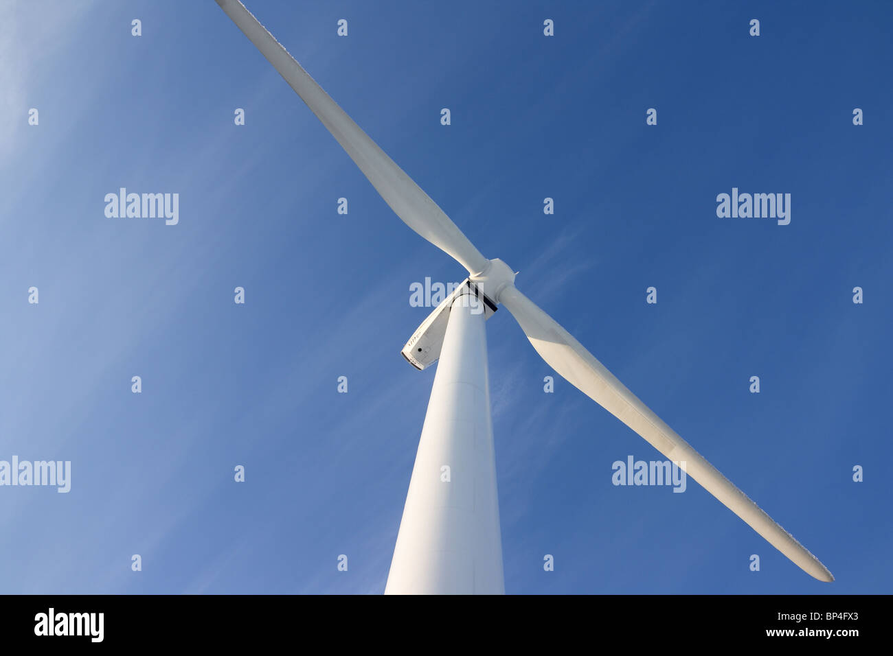 Single wind turbine against deep blue sky Stock Photo - Alamy