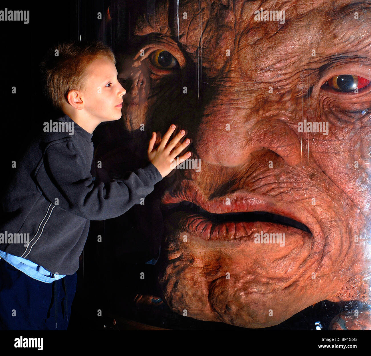 Stephen Hood,(9), meets the face of Boe-The oldest living being in the universe, at the Dr Who Up Close exhibition Stock Photo