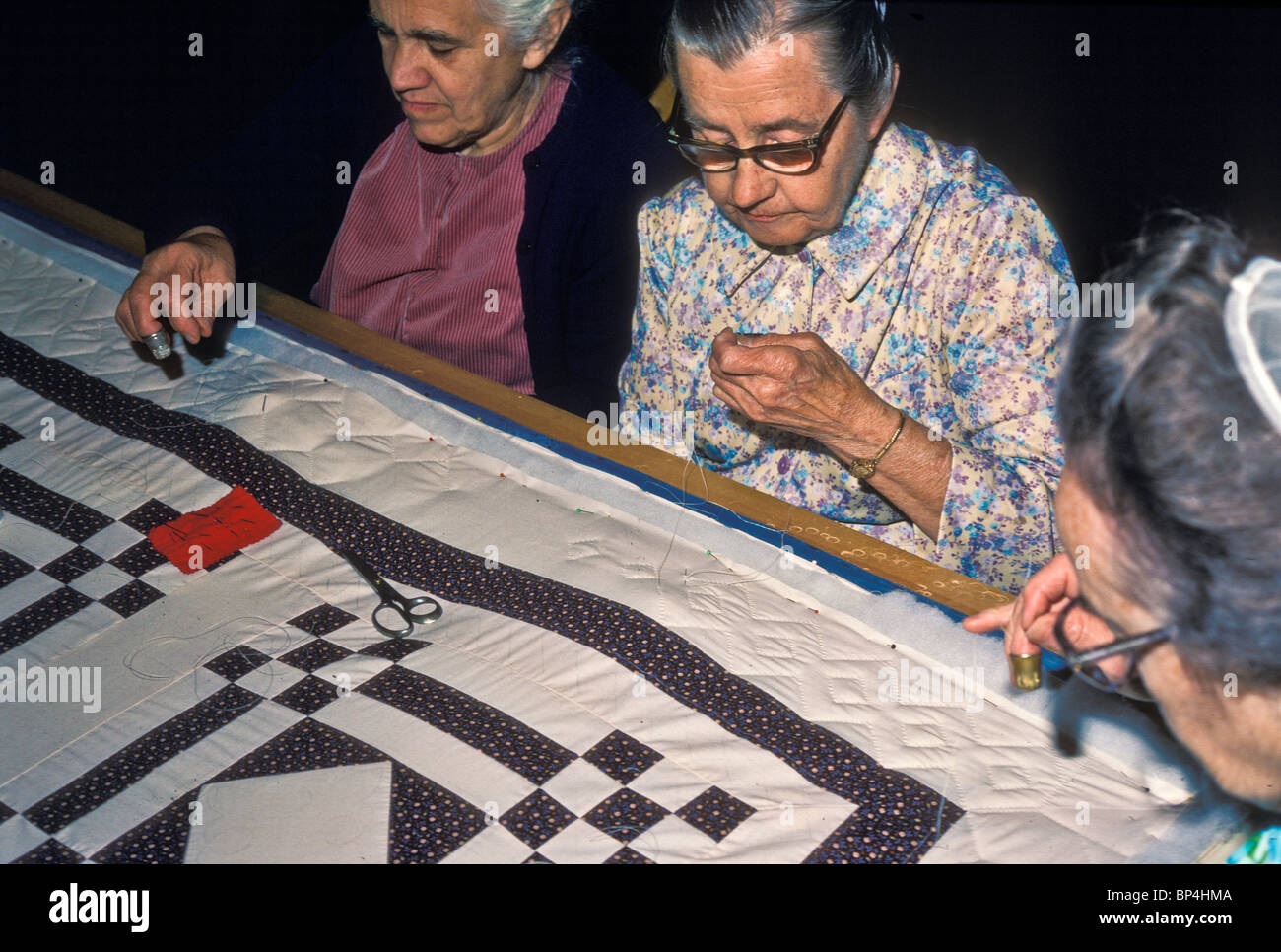 Women quilting colonial hi-res stock photography and images - Alamy