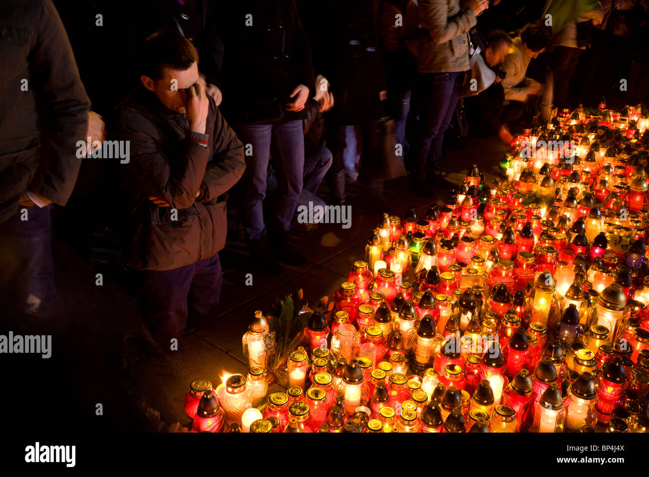 Warsaw Poland: People gather at the Presidential Palace in memory of president Lech Kaczynski and 95 others... Stock Photo