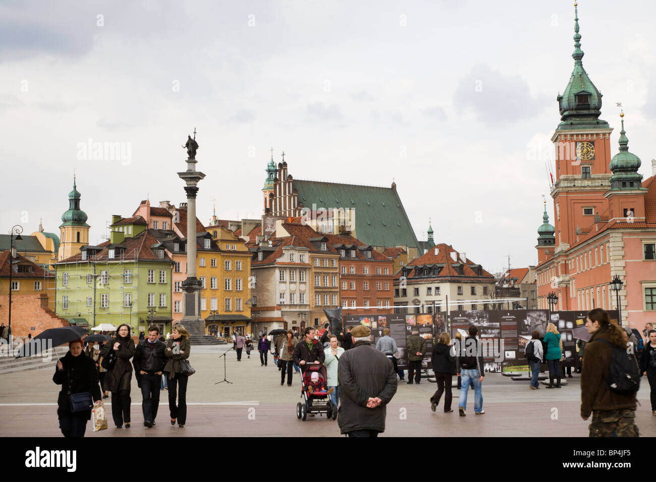 Castle Square, Warsaw Poland: People looking at an outdoor exhibition about the 1939 German and Soviet invasions of Poland. Stock Photo
