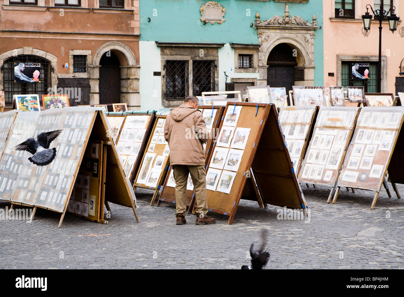 Paintings sold by local artists at Old Town Market Place, Warsaw Poland. Stock Photo