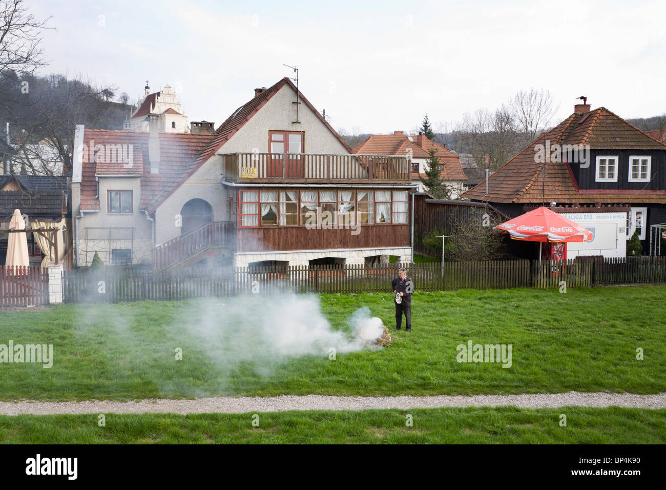Man burning hay. Kazimierz Dolny Poland. Stock Photo